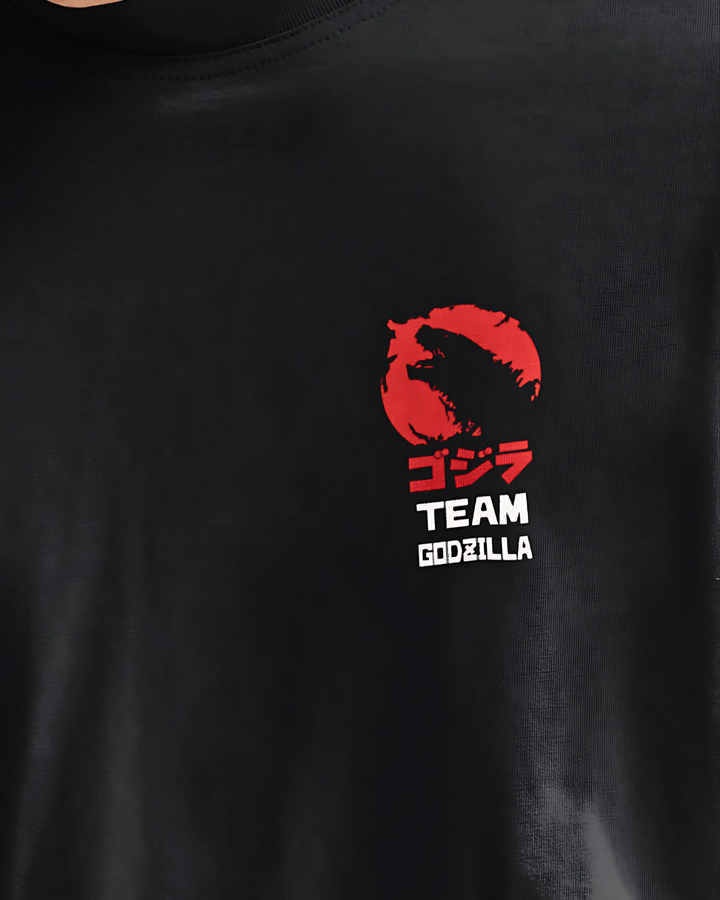 Black t-shirt with red and white 'Team Godzilla' logo on a plain background