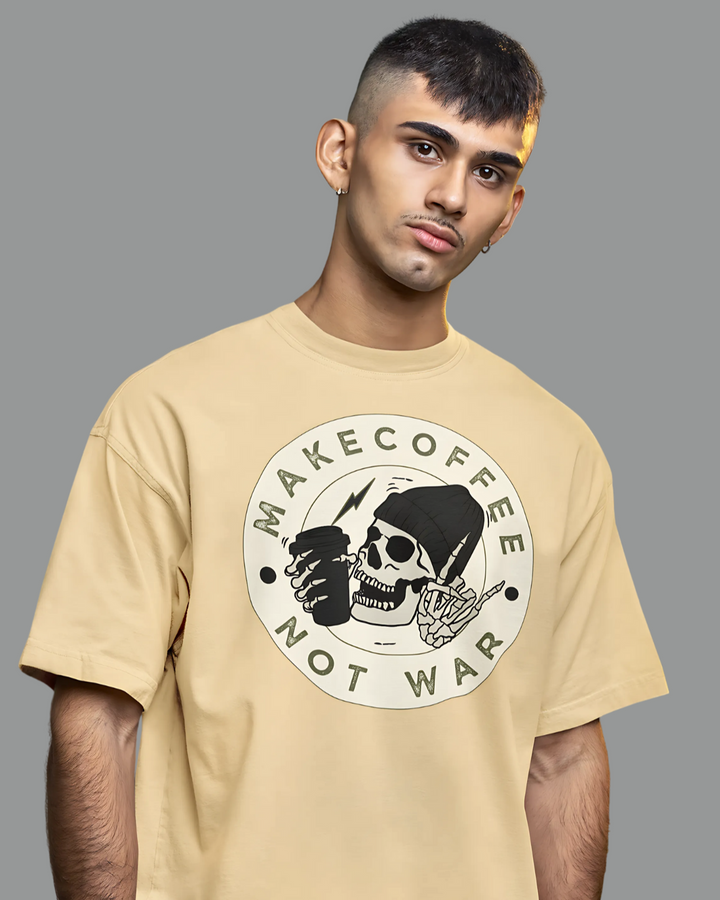 Man wearing a beige t-shirt with a graphic design and text on a gray background